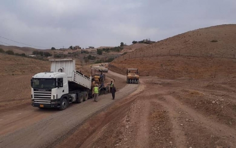 Surface road dressing of broken stones before the start of the road repair project of Biuka Gowra village 