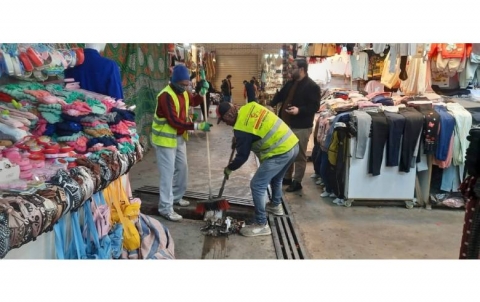 Cleaning and collecting of garbage and waste in Langa market 